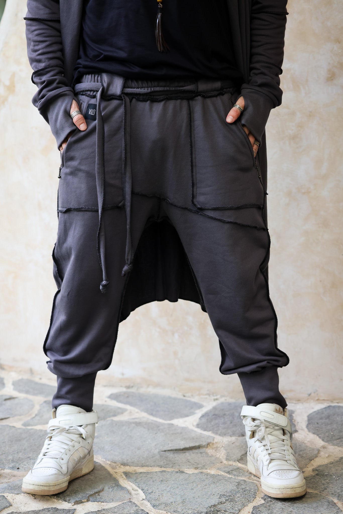 VALO Design Pants NORTHENER - These jogger style cotton pants are made from high quality and durable 100% Cotton French Terry fabric. Two zipper pockets on the sides, unique overlock stitching details.